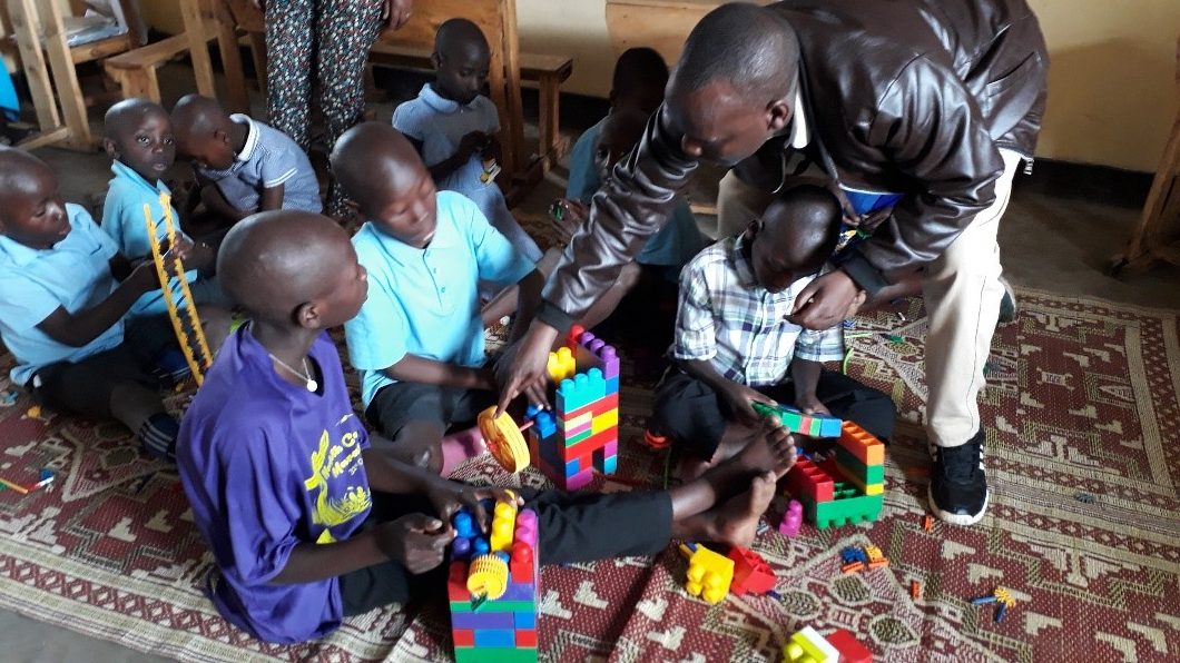 Louis, the founder, enjoying discovering how to play with new toys – they have never seen anything like it!  