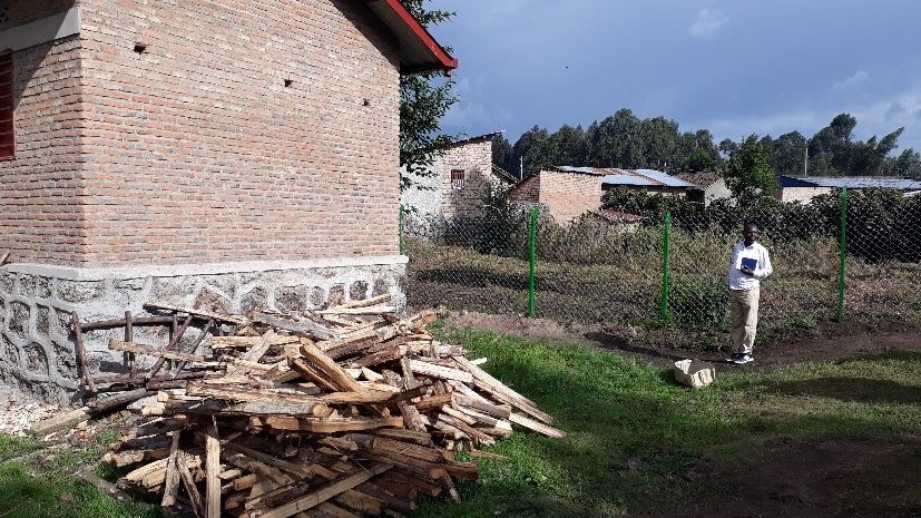 Here is the wood for the kitchen.  It would be good to have a gas cooker. The place where the wood has been temporarily deposited is where they would like to build a chicken house.
